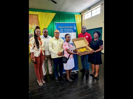 The Rotary Club of Kingston recently presented  an automated external  defibrillator (AED) to the Excelsior College.  From left are: Carolyn Gardner, president-elect, Rotary  Club of Kingston; Karsten Johnson, Assistant Governor, Rotary District 7020; Will