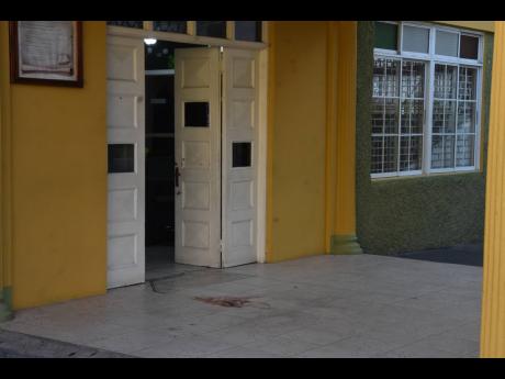 The area where Cora Thompson's body laid after she was shot by an unknown gunman on Wednesday inside the church yard at the New Testament Church of God in Montego Bay, St James. 