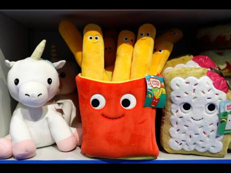 Plush toys are displayed at a Camp store in New York. Camp, November 21, 2019. (AP Photo/Mark Lennihan, File)
