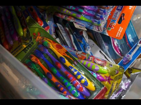 Toothbrushes are pictured in Alexandria, Va., Thursday, March 6, 2025. (AP Photo/Jessie Wardarski, File)