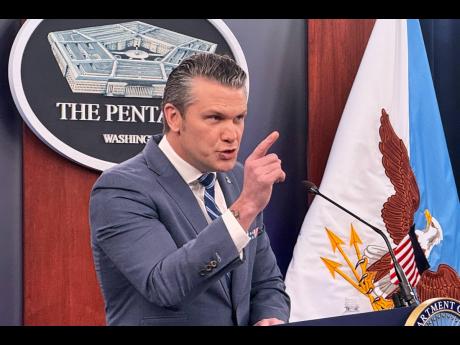 Credit: Kevin Wolf Defence Secretary Pete Hegseth speaks to members of the media during a press briefing at the Pentagon in Washington, Thursday, April 16, 2026. (AP Photo/Kevin Wolf)
