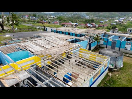 This photo shows damaged roof of Darliston Primary School destroyed by Hurricane Melissa last October.