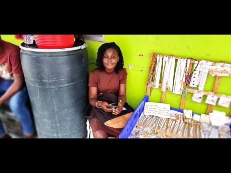 Franceita Renford at her workstation on a corridor along West Street in Port Antonio, Portland.