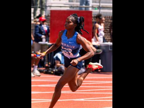 An Edwin Allen athlete competes in the Championship of America 4x100 metres at the Penn Relays inside the Franklin Field stadium in Philadelphia last week.
