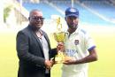 Credit: Lennox Aldred Barbados Pride captain Kragg Brathwaite (right) collects the bilateral series trophy from Jamaica Cricket Association CEO Courtney Francis at the end of the West Indies Championship match against Jamaica Scorpions at Sabina Park on Tuesday.